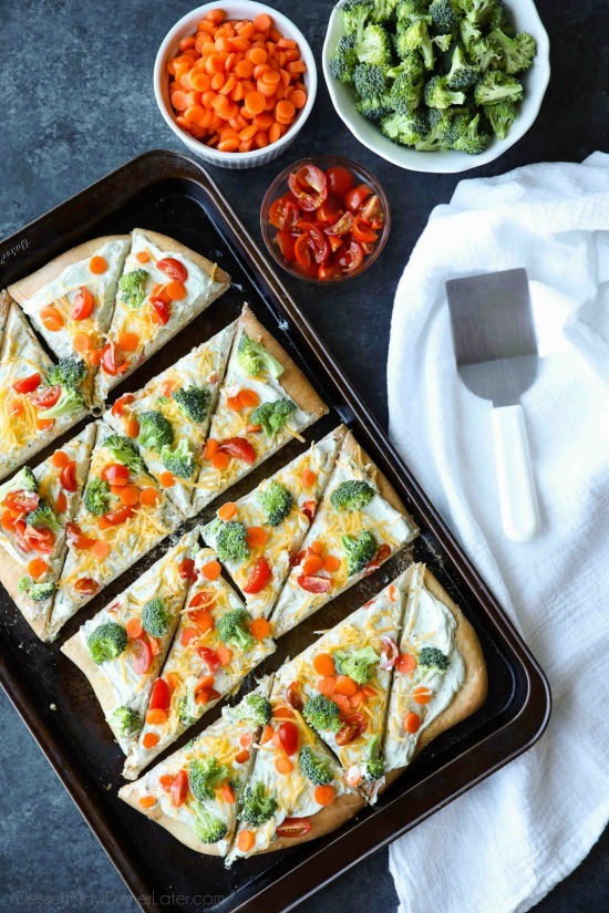 This cold vegetable pizza is the ultimate party appetizer for summer potlucks. With a fresh baked crust, creamy ranch spread, and crunchy fresh veggies, everyone will be coming back for seconds!