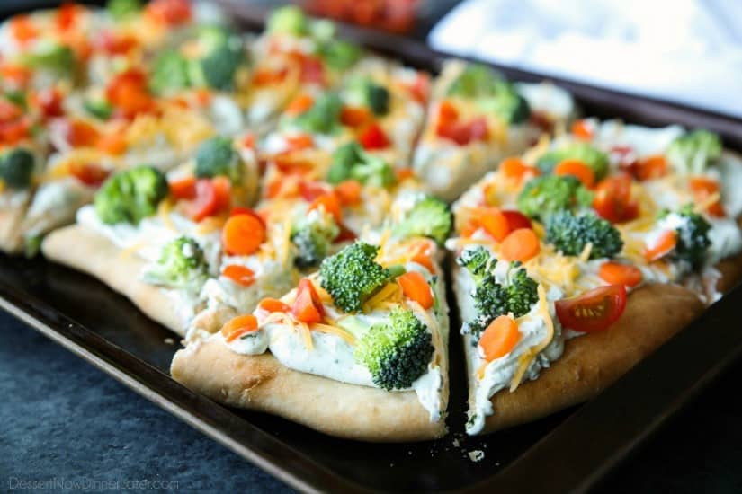 This cold vegetable pizza is the ultimate party appetizer for summer potlucks. With a fresh baked crust, creamy ranch spread, and crunchy fresh veggies, everyone will be coming back for seconds!