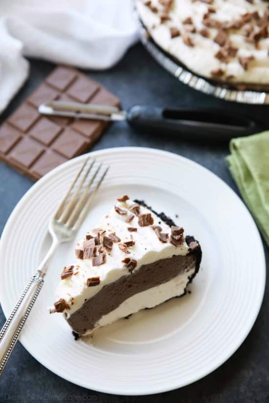 This no bake cheesecake has two layers of light and smooth cheesecake -- creamy vanilla and decadent chocolate, layered inside a chocolate cookie crust, and topped with sweetened whipped cream and chocolate shavings. It's an easy and delicious summer dessert!