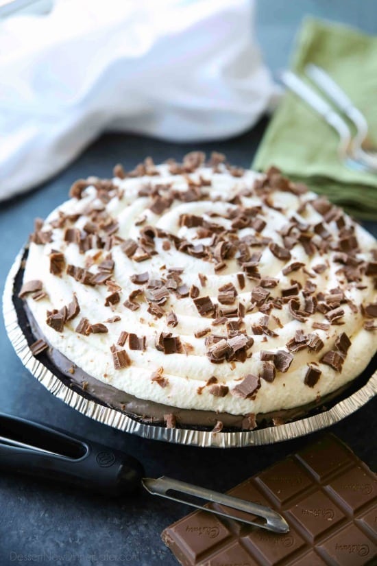 This no bake cheesecake has two layers of light and smooth cheesecake -- creamy vanilla and decadent chocolate, layered inside a chocolate cookie crust, and topped with sweetened whipped cream and chocolate shavings. It's an easy and delicious summer dessert!