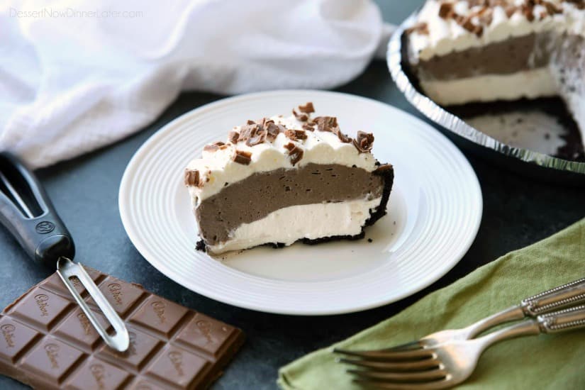 This no bake cheesecake has two layers of light and smooth cheesecake -- creamy vanilla and decadent chocolate, layered inside a chocolate cookie crust, and topped with sweetened whipped cream and chocolate shavings. It's an easy and delicious summer dessert!