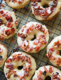 Maple Bacon Donuts are breakfast perfection! The salty bacon cuts through the sweetness of the maple and brown sugar glaze on top of a fluffy yeast donut.