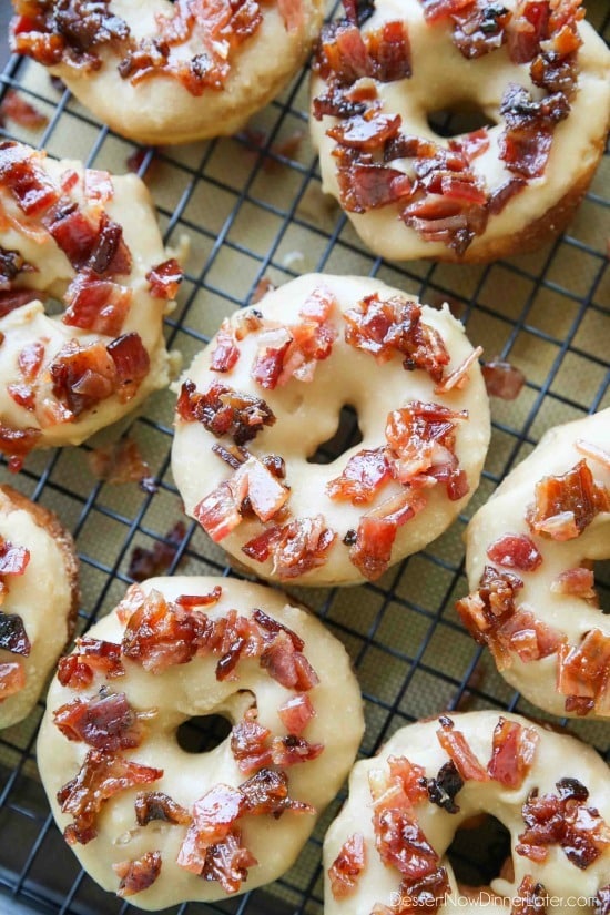 Maple Bacon Donuts are breakfast perfection! The salty bacon cuts through the sweetness of the maple and brown sugar glaze on top of a fluffy yeast donut.