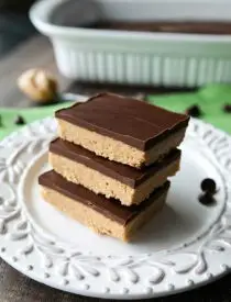 Easy No Bake Peanut Butter Bars taste a lot like a Reese's Peanut Butter Cup. The perfect party pleasing dessert with a sweet peanut butter base, and creamy chocolate ganache topping.