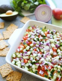 This Skinny Seven Layer Dip is loaded with fresh veggies, and makes a great appetizer or snack for any party or barbecue!