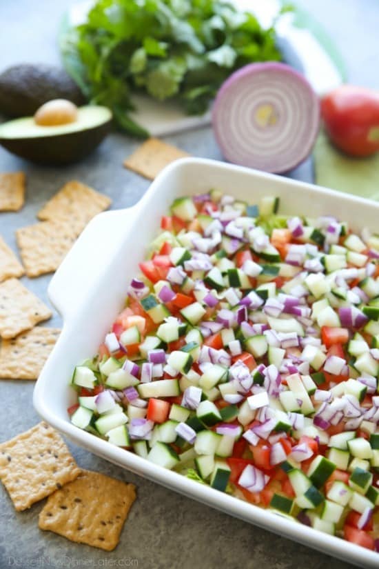 This Skinny Seven Layer Dip is loaded with fresh veggies, and makes a great appetizer or snack for any party or barbecue!