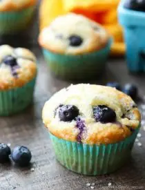 These Blueberry Muffins are so easy to make! With plump blueberries throughout and coarse sugar sprinkled on top, you'll love nibbling on these tasty muffins for breakfast (or brunch)!