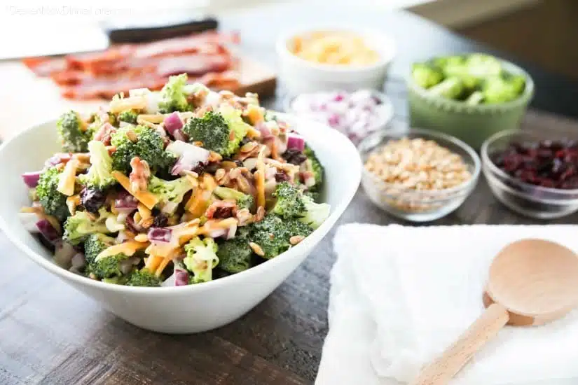 This Broccoli Salad recipe is our favorite! It's creamy, sweet, and salty, with the just the right amount of crunch. A great side dish for barbecues, potlucks, picnics or parties. Everyone loves this salad!