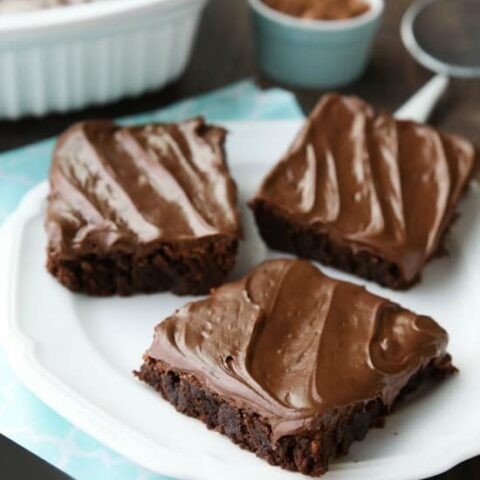 Chocoholics NEED these Frosted Fudge Brownies! Super fudgy homemade brownies are topped with a smooth and creamy fudge chocolate frosting for ultimate chocolate pleasure. Great for lunch box treats, dessert, or anytime!