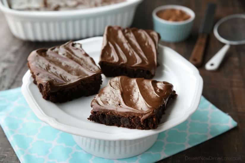 Chocoholics NEED these Frosted Fudge Brownies! Super fudgy homemade brownies are topped with a smooth and creamy fudge chocolate frosting for ultimate chocolate pleasure. Great for lunch box treats, dessert, or anytime!