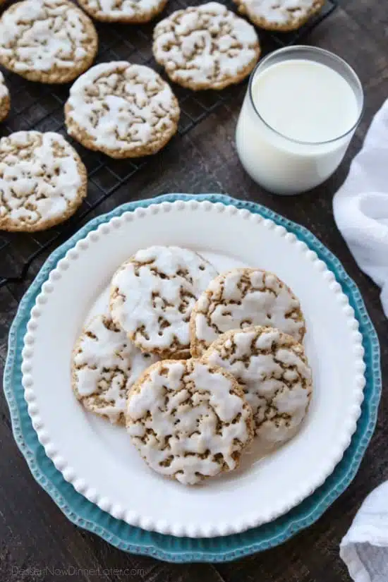 Old fashioned Iced Oatmeal Cookies are crisp on the outside, soft and chewy on the inside, with warm spices, and a light glaze on top. Perfect with a cold glass of milk!