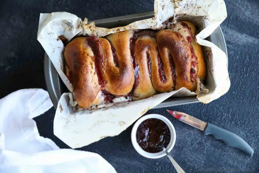 Intestines Bread is a fun halloween party food that makes you look twice. All it really is, is a sweet pull apart bread with cream cheese and raspberries.