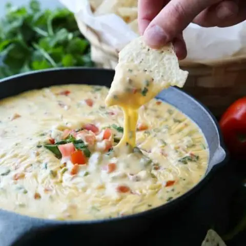 This Queso Dip is classic! Make it mild or hot, chunky or smooth. It's extremely versatile and made with simple ingredients. No Velveeta! A tasty appetizer or snack for game day or any party gathering!