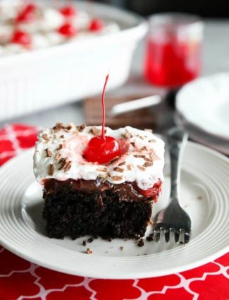 Black Forest Poke Cake is a classic recipe made easy. Plus it serves a crowd! Everyone loves the delicious chocolate-cherry combo in this loaded dessert.