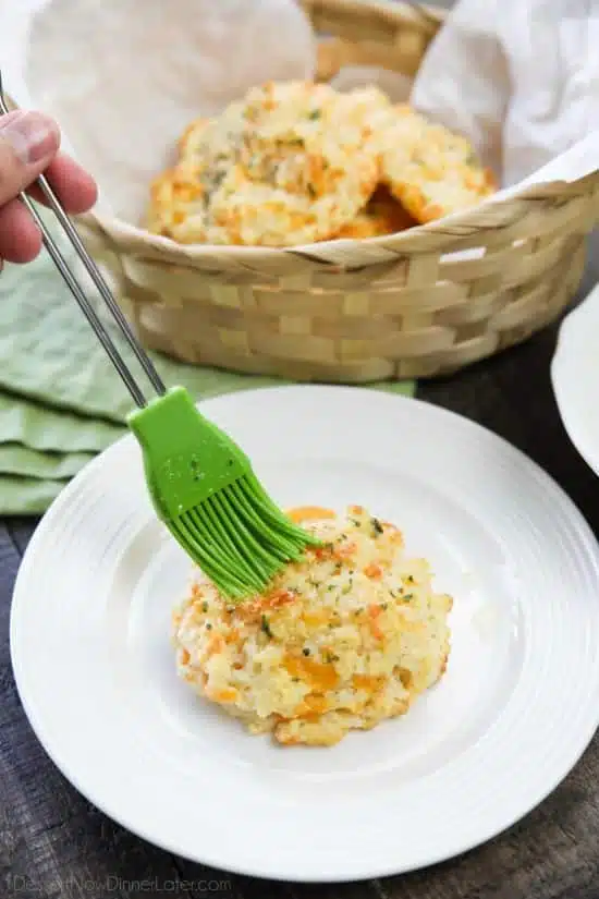 This copycat Red Lobster Cheddar Bay Biscuits recipe is super delicious! Crisp edges, a fluffy biscuit center, with plenty of cheese, garlic, and extra butter slathered on top. You won't be able to eat just one!