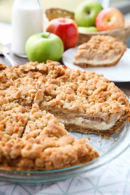 Apple Streusel Cheesecake Pie combines two dessert favorites with a graham cracker crust, creamy cheesecake layer, homemade apple pie filling, and crunchy streusel topping.