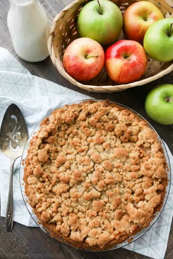 Apple Streusel Cheesecake Pie combines two dessert favorites with a graham cracker crust, creamy cheesecake layer, homemade apple pie filling, and crunchy streusel topping.