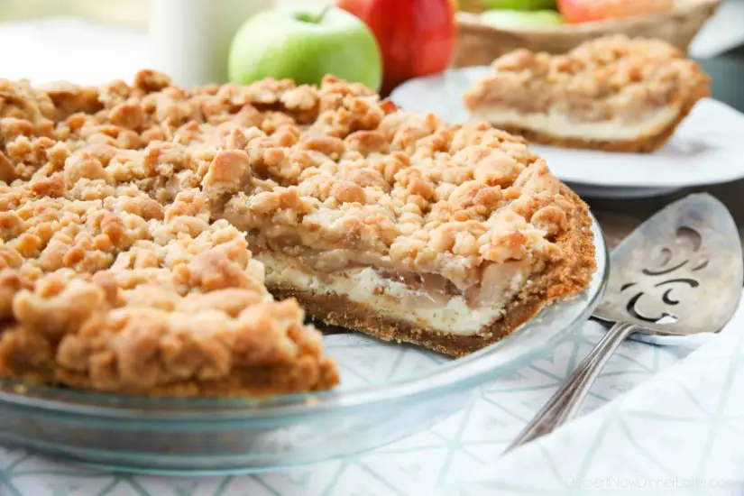 Apple Streusel Cheesecake Pie combines two dessert favorites with a graham cracker crust, creamy cheesecake layer, homemade apple pie filling, and crunchy streusel topping.