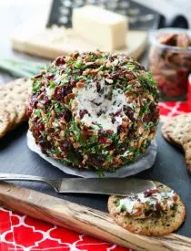 This Cranberry Pecan Cheese Ball is a festive appetizer for Thanksgiving, Christmas, or New Year's Eve! So easy to make, and tastes great!