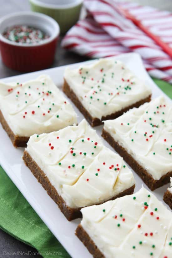 Gingerbread Cookie Bars have a soft and chewy, spiced molasses cookie base topped with the BEST cream cheese frosting. Add red and green sprinkles or nonpareils for a festive Christmas dessert!