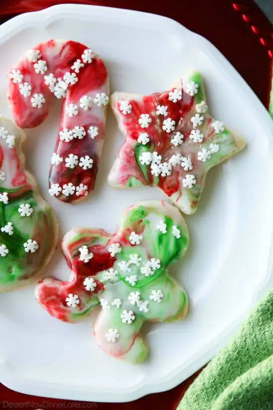 Swirled Christmas Sugar Cookies make cookie decorating easy! Simply swirl food coloring in a special glaze and dip the cookie! The kids will love making these for Santa! 