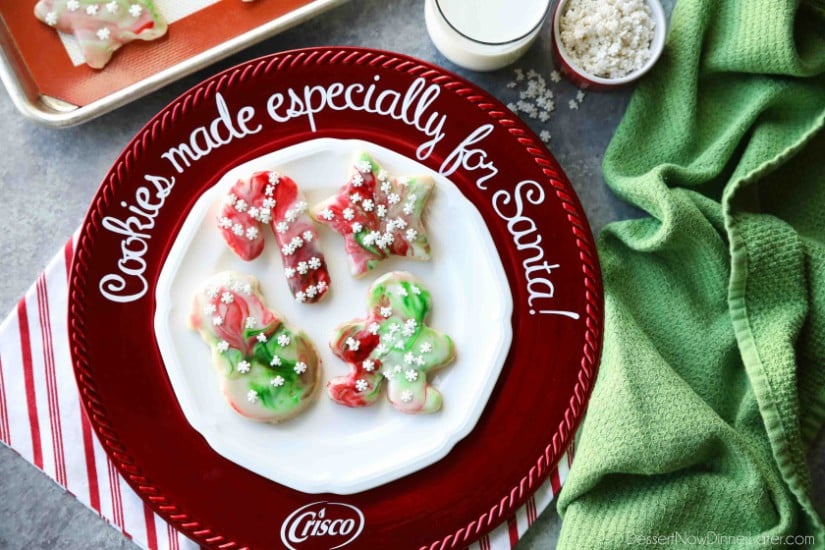 Swirled Christmas Sugar Cookies make cookie decorating easy! Simply swirl food coloring in a special glaze and dip the cookie! The kids will love making these for Santa! 