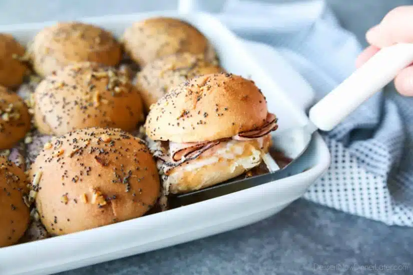 Ham and Cheese Sliders are baked in the oven with a buttery honey-mustard topping. Use leftover Christmas ham, or make them for dinner or game night. They're fast, easy, and feed a crowd!