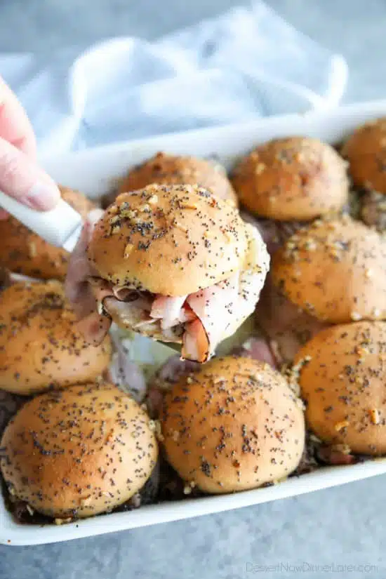 Ham and Cheese Sliders are baked in the oven with a buttery honey-mustard topping. Use leftover Christmas ham, or make them for dinner or game night. They're fast, easy, and feed a crowd!