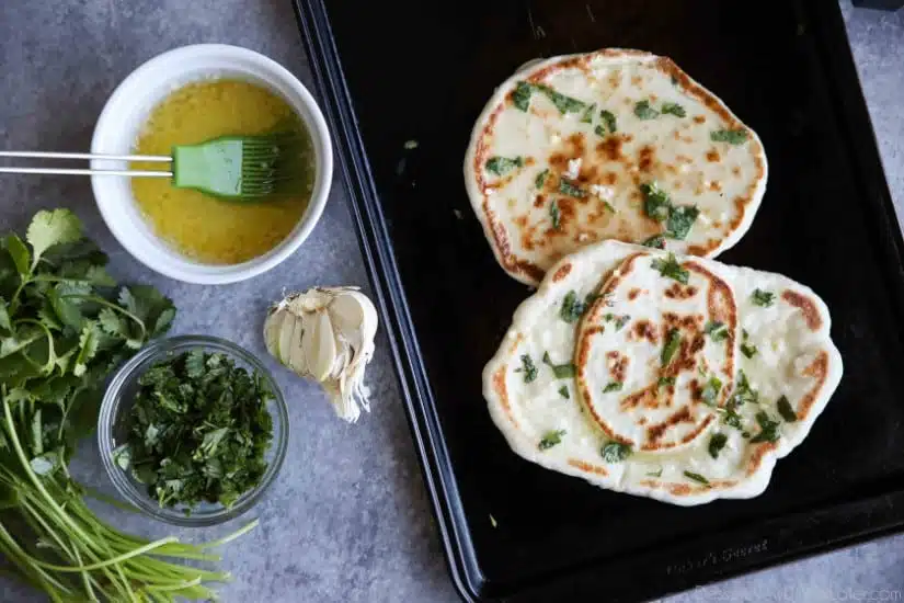 This buttery Garlic Naan flatbread is made easy with store-bought frozen dough. Enjoy restaurant-style Indian bread with dinner anytime, it's so easy!