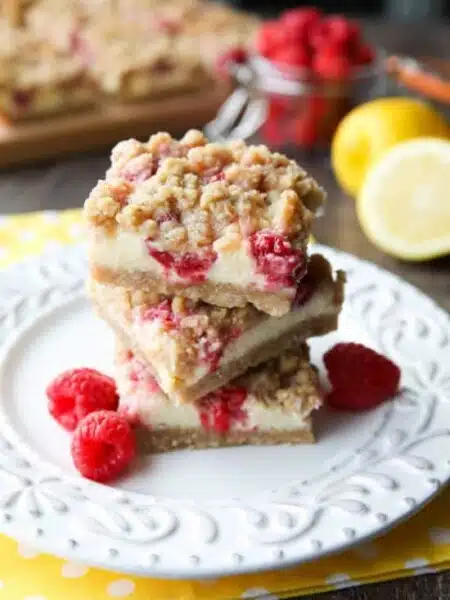 Lemon Raspberry Crumb Bars have a creamy and tangy-sweet filling sandwiched between a brown sugar and oat crust that doubles as the crumb topping. These dessert bars are to die for!