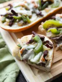 Philly Cheesesteak French Bread is a delicious open-faced sandwich with plenty of juicy meat, crisp veggies, and melty cheese for an easy dinner that is sure to satisfy!