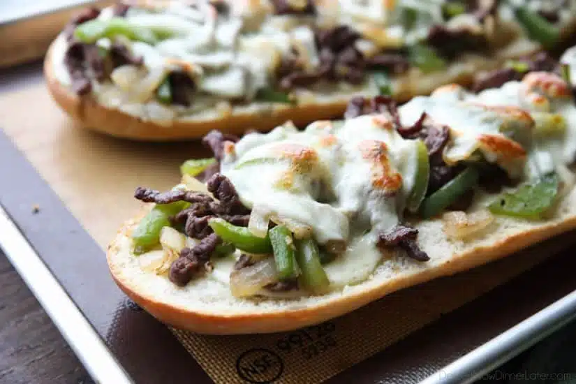 Philly Cheesesteak French Bread is a delicious open-faced sandwich with plenty of juicy meat, crisp veggies, and melty cheese for an easy dinner that is sure to satisfy!