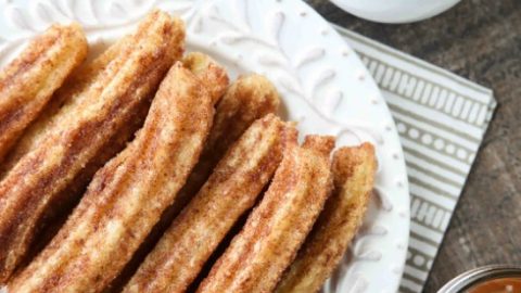 This churros recipe is super easy to make with a simple churro dough that is piped into oil and fried, then coated in cinnamon-sugar. You can enjoy these crisp, yet soft homemade churros anytime!