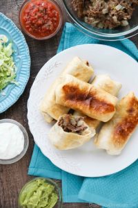 Instant Pot Chimichangas are a favorite family dinner with tender shredded beef, seasoned to perfection, and wrapped in tortillas to fry or bake. (+ Recipe Video!)