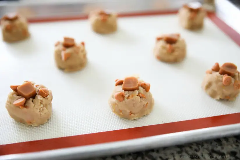 Salted Caramel Cookies are soft, chewy, and full of caramel, with just the right amount of salt. This sweet and salty dessert is one recipe you'll make again and again!