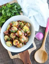 There's no mayo in this flavorful Bacon Potato Salad that's dressed with an easy garlic and honey-mustard vinaigrette. Delicious warm or cold, you'll enjoy making this zesty Bacon Potato Salad for picnics, potlucks, parties, and events!