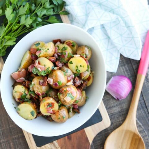 There's no mayo in this flavorful Bacon Potato Salad that's dressed with an easy garlic and honey-mustard vinaigrette. Delicious warm or cold, you'll enjoy making this zesty Bacon Potato Salad for picnics, potlucks, parties, and events!