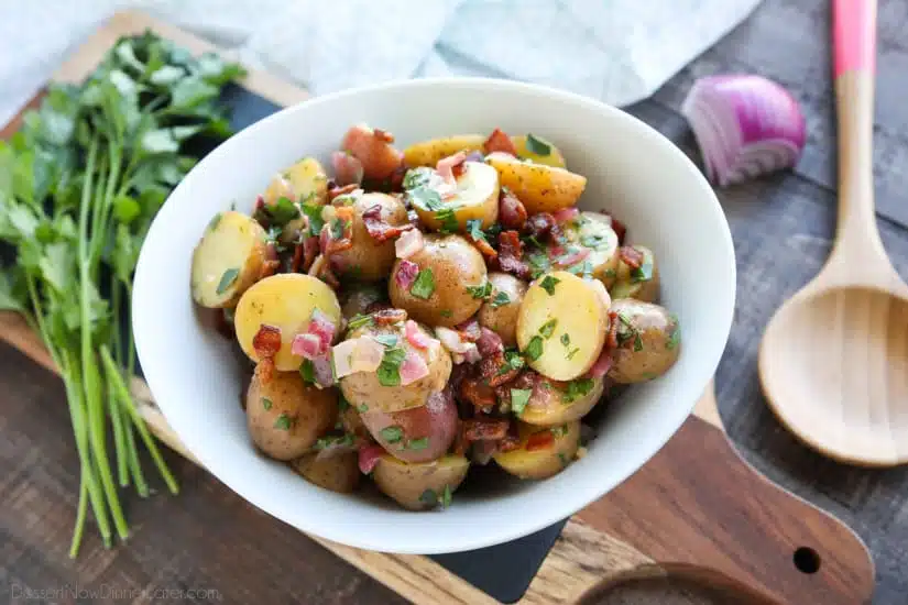 There's no mayo in this flavorful Bacon Potato Salad that's dressed with an easy garlic and honey-mustard vinaigrette. Delicious warm or cold, you'll enjoy making this zesty Bacon Potato Salad for picnics, potlucks, parties, and events!