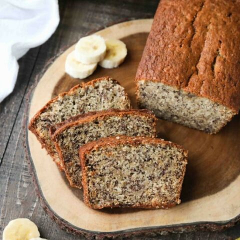 Use up those ripe bananas in this easy Banana Bread Recipe. The most delicious, moist, classic banana bread recipe. No mixer needed for this one-bowl quick bread.