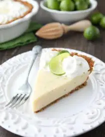 This classic Key Lime Pie recipe is smooth and creamy, tart yet sweet, and super easy to make! Top it with freshly sweetened whipped cream for the perfect bite!