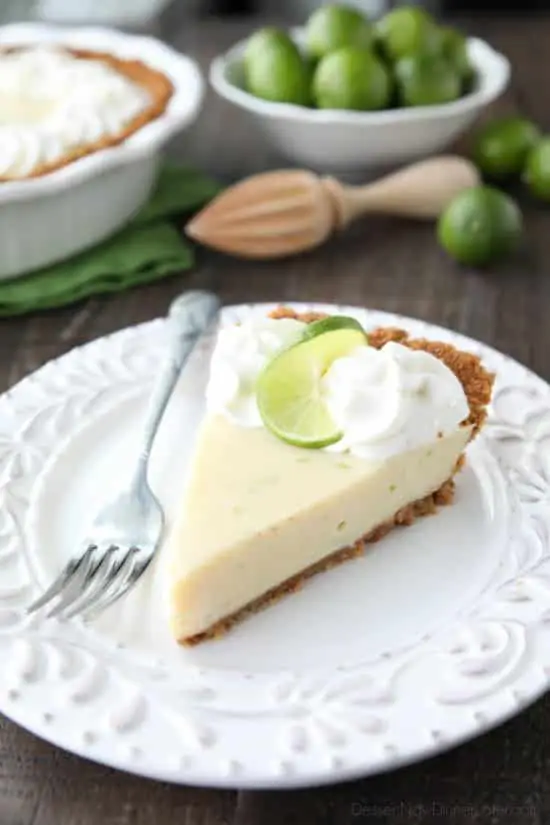 This classic Key Lime Pie recipe is smooth and creamy, tart yet sweet, and super easy to make! Top it with freshly sweetened whipped cream for the perfect bite!