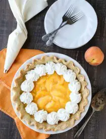 This Fresh Peach Pie has a no-bake filling that uses fresh, uncooked peaches and a simple homemade glaze inside of a crisp pie crust. A great recipe for fresh peaches!