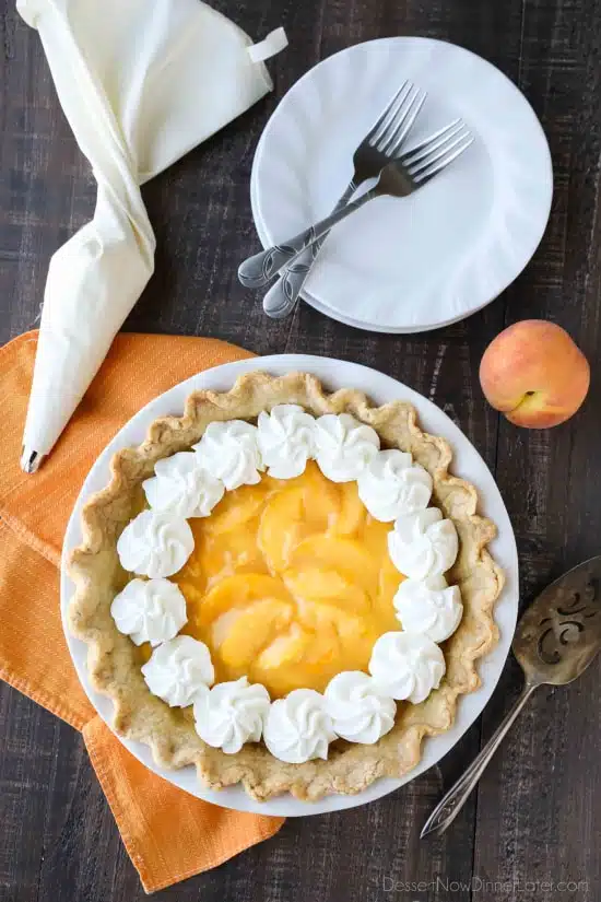 This Fresh Peach Pie has a no-bake filling that uses fresh, uncooked peaches and a simple homemade glaze inside of a crisp pie crust. A great recipe for fresh peaches!