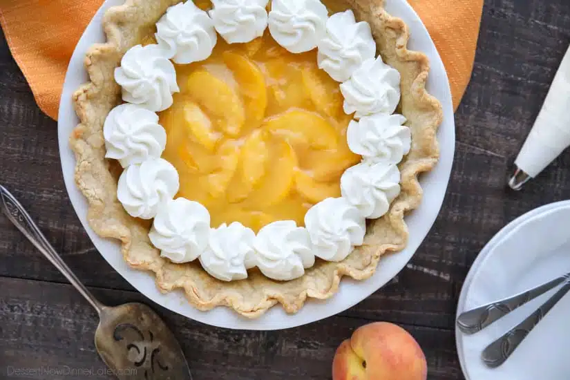 This Fresh Peach Pie has a no-bake filling that uses fresh, uncooked peaches and a simple homemade glaze inside of a crisp pie crust. A great recipe for fresh peaches!