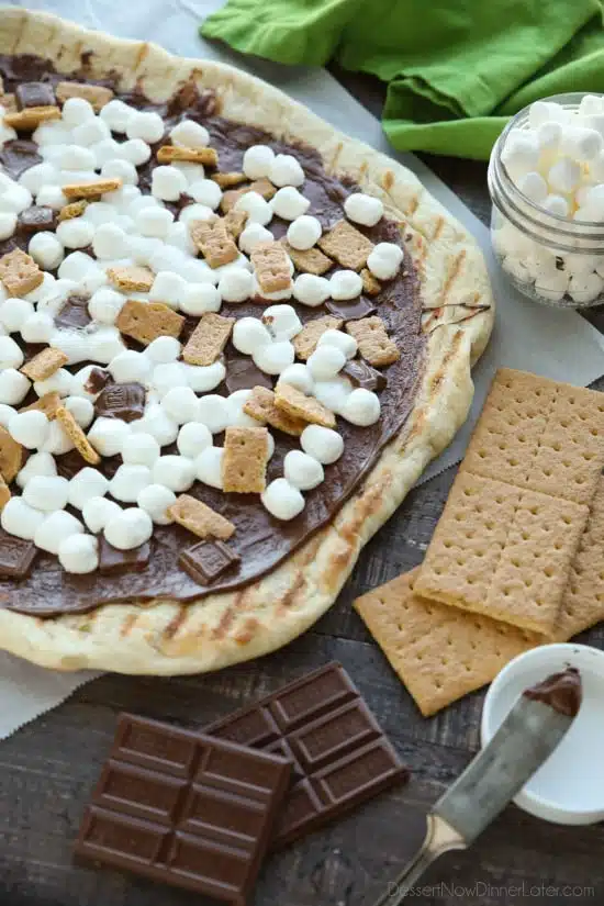 Make your dessert outside! This Grilled S'mores Pizza is an easy and delicious dessert with all the flavors of everyone's favorite campfire treat! 