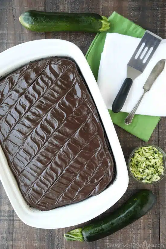 Chocolate Zucchini Cake is rich and moist, and topped with a decadent chocolate frosting. You'd never know there was zucchini hidden in this easy and delicious chocolate cake!