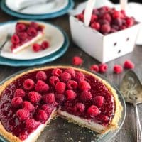 Raspberry Cream Pie has layers of no-bake cheesecake and an easy raspberry pie filling inside of a vanilla wafer crust. It's not too sweet, not too tart, is perfectly light and satisfying, and can be made year round with fresh or frozen raspberries.