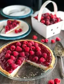 Raspberry Cream Pie has layers of no-bake cheesecake and an easy raspberry pie filling inside of a vanilla wafer crust. It's not too sweet, not too tart, is perfectly light and satisfying, and can be made year round with fresh or frozen raspberries. 