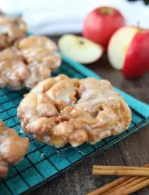 Apple Fritters - an easy and delicious yeast doughnut with chunks of apples, ground cinnamon, and a sweet glaze.