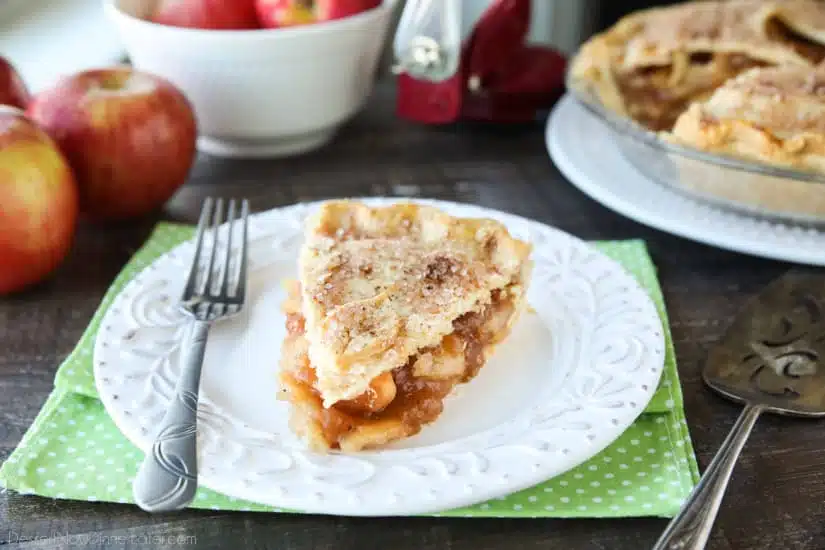 This homemade apple pie recipe has a flaky pie crust with cinnamon-sugar sprinkled on top and an extra fruity apple pie filling with just the right amount of sauce.